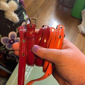 Red and orange patent leather belts
